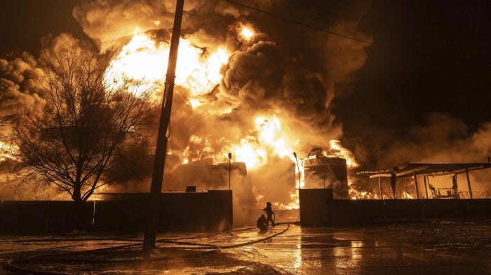 Firefighters extinguish a fire after a Russian attack on a neighborhood in Kharkiv, Ukraine, February 10, 2024.