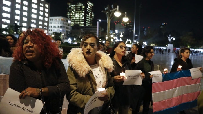  People carry the names of murdered transgendered women as dozens of transgender women and allies gather to commemorate murdered members of their community on Transgender Day of Remembrance in Mexico City.