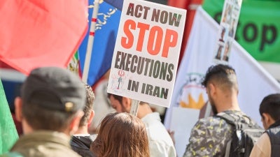 A demonstration on the anniversary of the death in custody of Mahsa Jina Amini with signs calling to stop the executions in Iran, September 14, 2024.