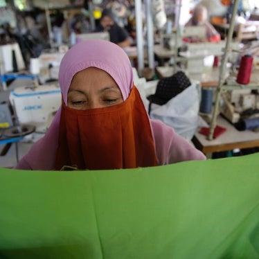 A worker sews a garment at a home-based apparel production operation in Bogor, Indonesia, March 4, 2021.