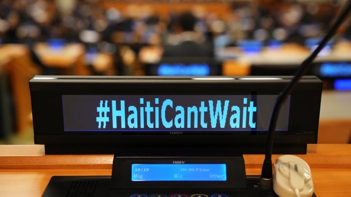 The social media slogan #HaitiCantWait is displayed as Canada Prime Minister Justin Trudeau takes part in high level meetings with an advisory group on Haiti at United Nations headquarters on September 23, 2024. 