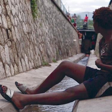 A homeless youth from the LGBT community sits in the sewer where he lives in Kingston, Jamaica. Rejected by their families and communities, many LGBT Jamaicans live on the streets, where they face violence and harassment.