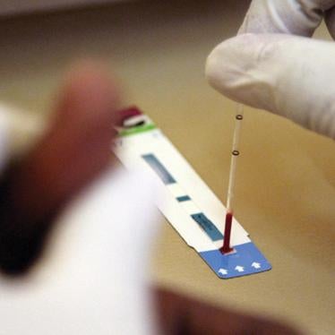 A health worker administers a voluntary HIV test at Chreso Ministries VCT (Voluntary Counseling & Testing) and ART (Anti Retroviral Treatment) Centre in Lusaka. 