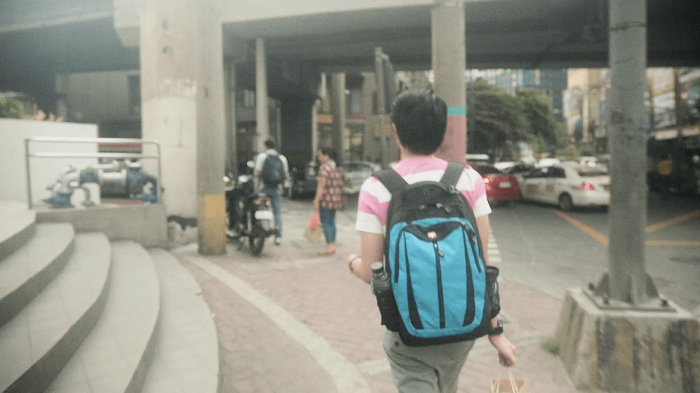 A student walks through the street in Manila, the Philippines. 